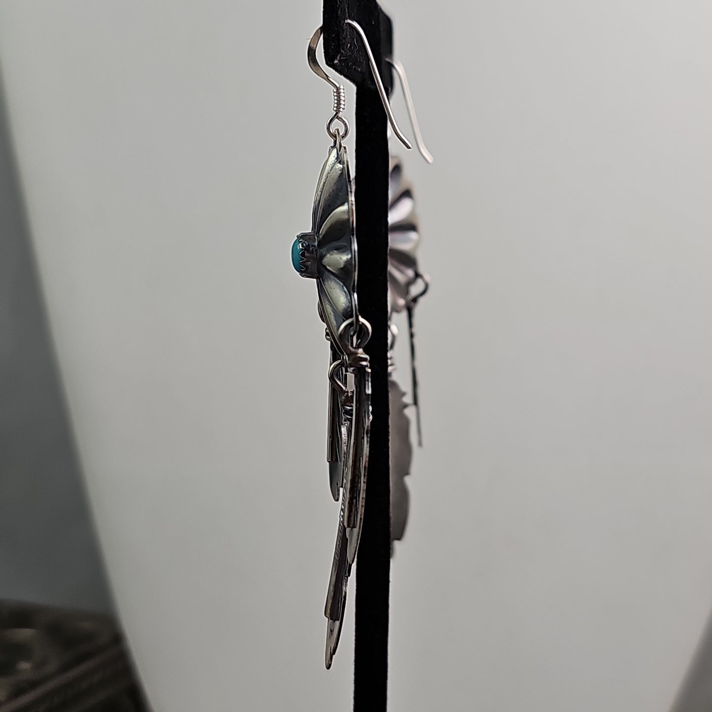Concho feather chandelier earrings.