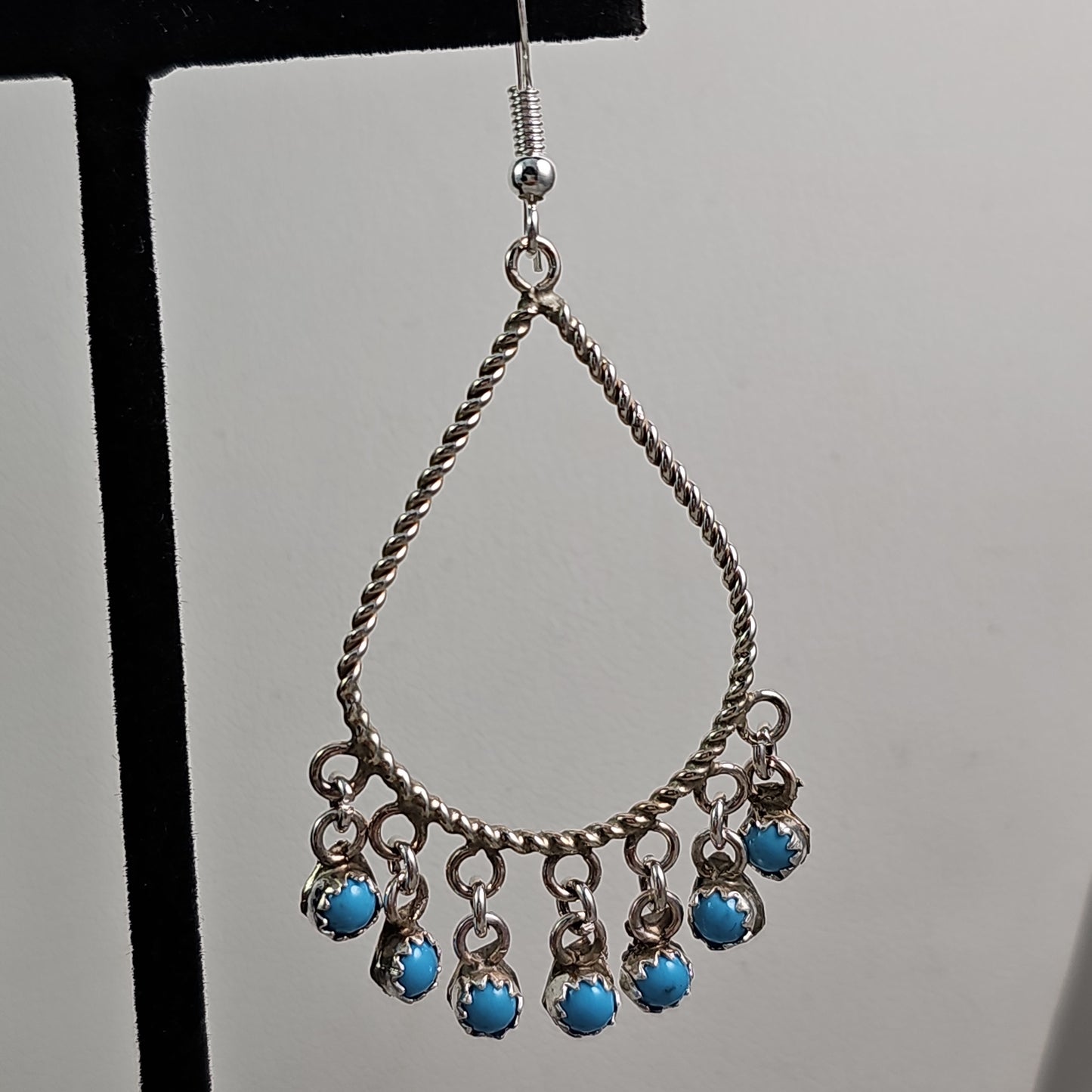 Snake eye charmed teardrop earrings
