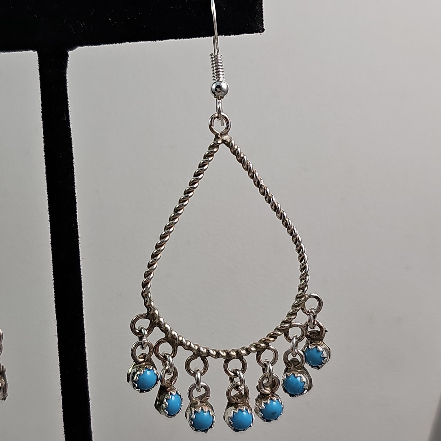 Snake eye charmed teardrop earrings