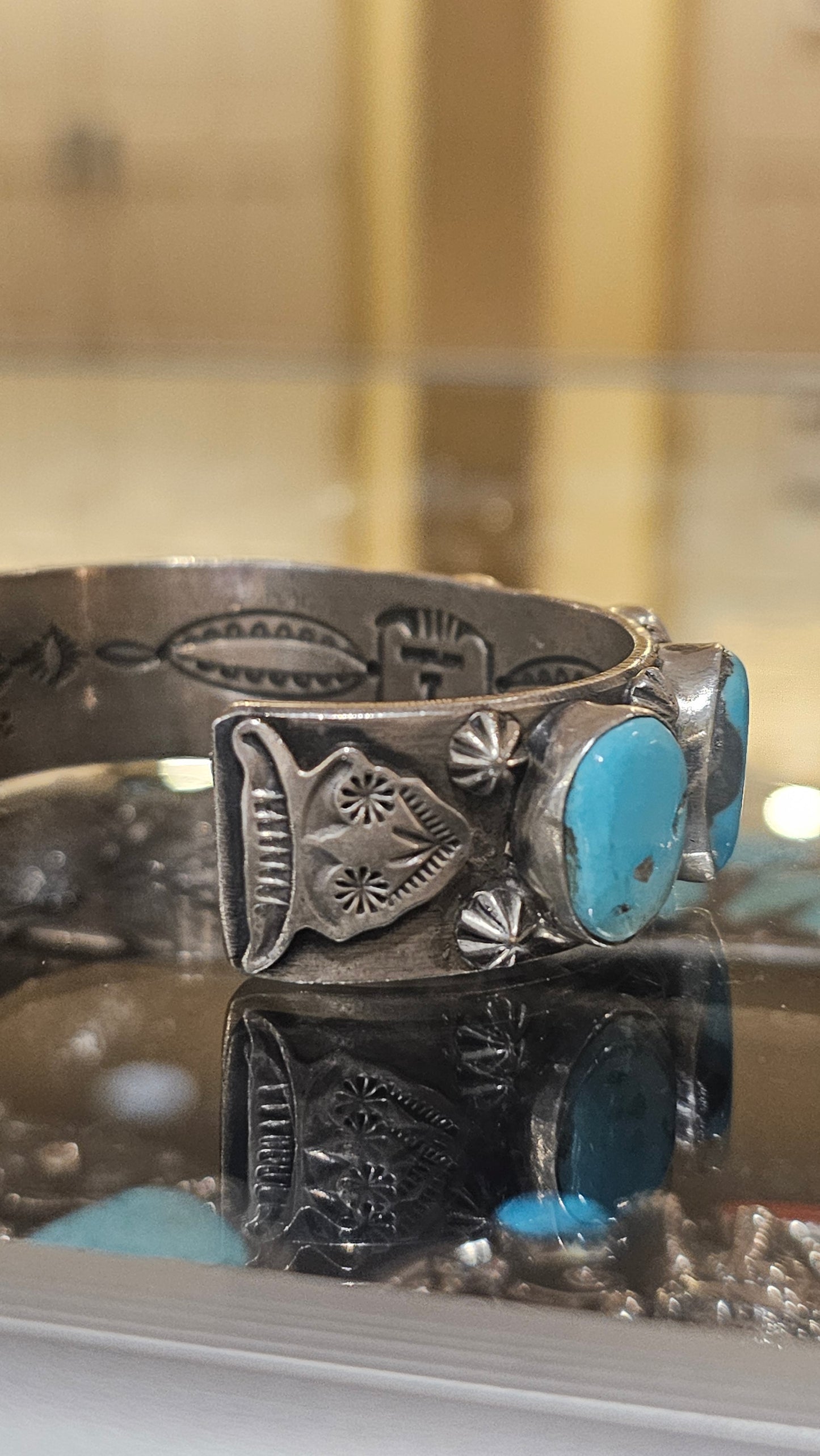 Turquoise and sterling button cuff with steer heads