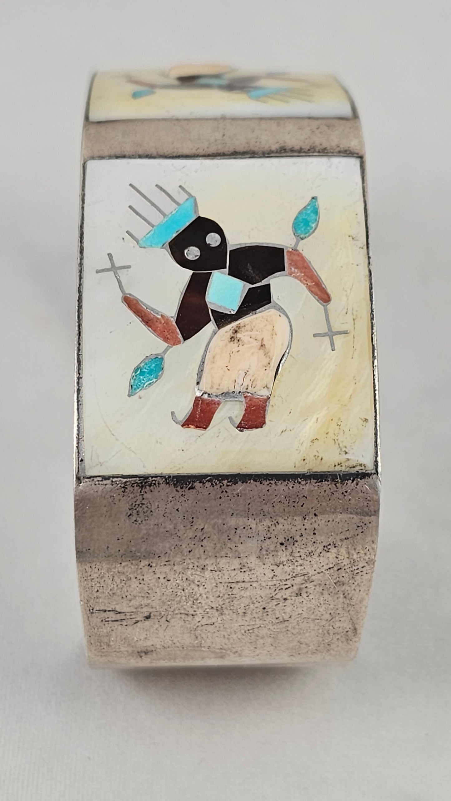 Vintage Zuni kachina inlay cuff by Tony Ohmsatte