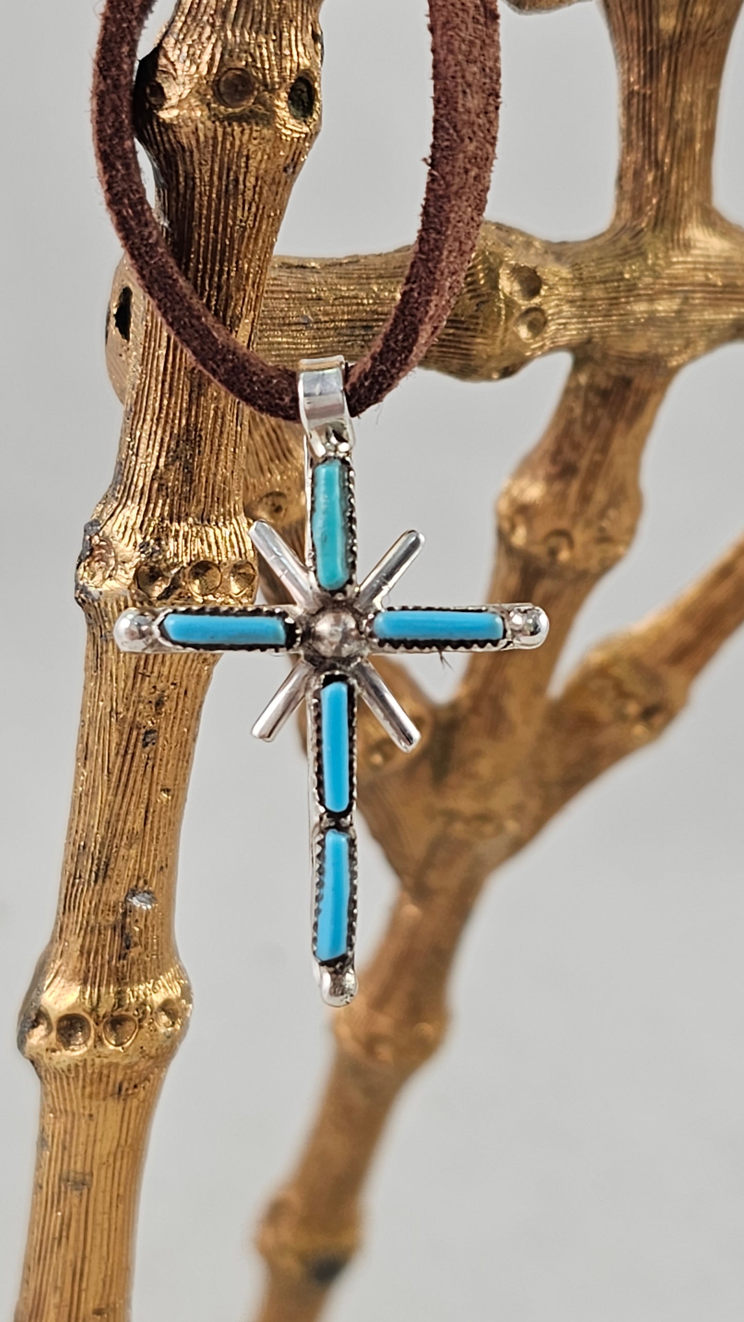 Needle point cross pendant