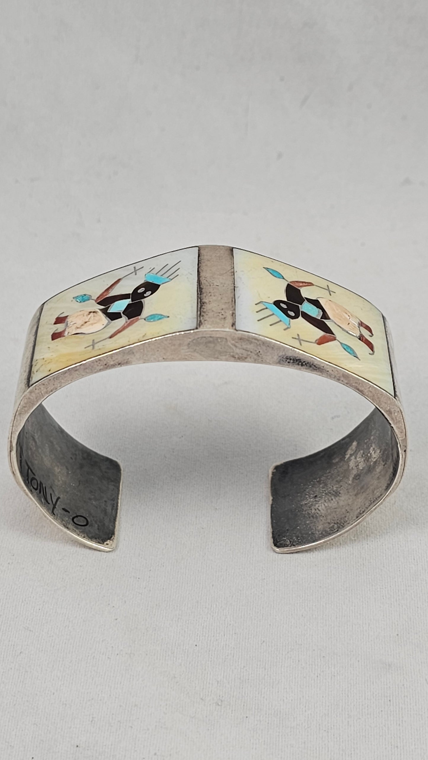 Vintage Zuni kachina inlay cuff by Tony Ohmsatte
