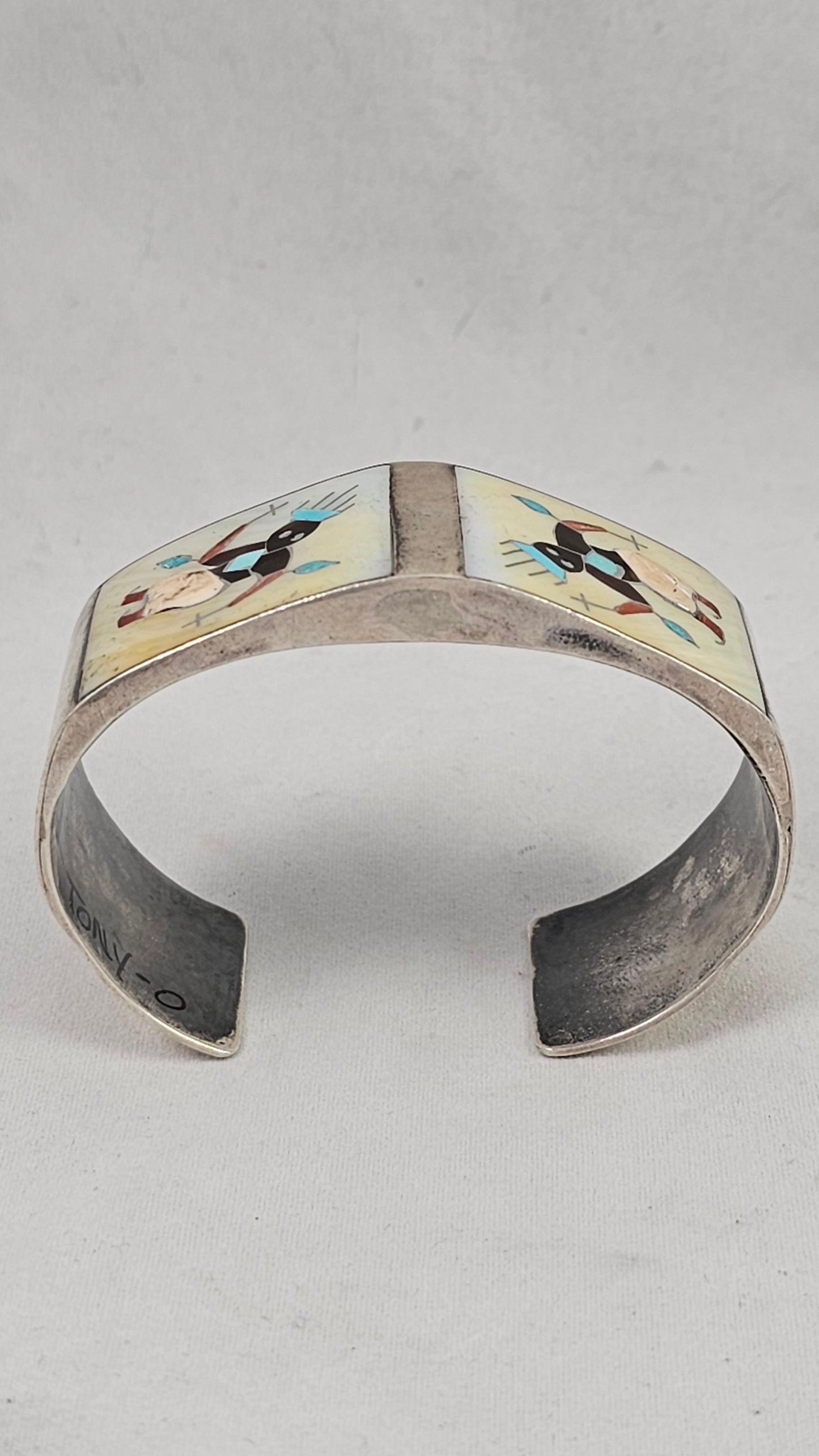 Vintage Zuni kachina inlay cuff by Tony Ohmsatte