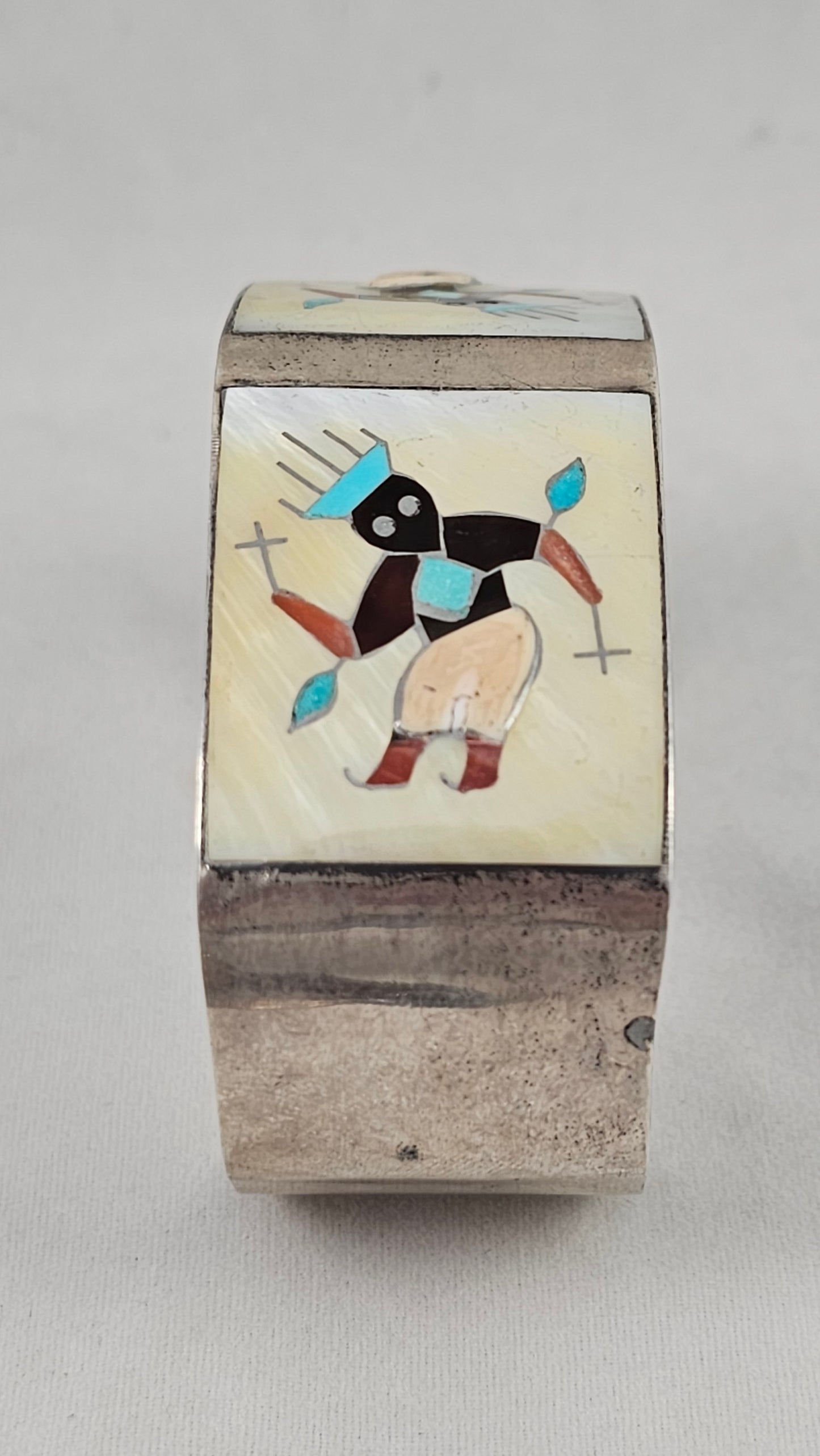 Vintage Zuni kachina inlay cuff by Tony Ohmsatte