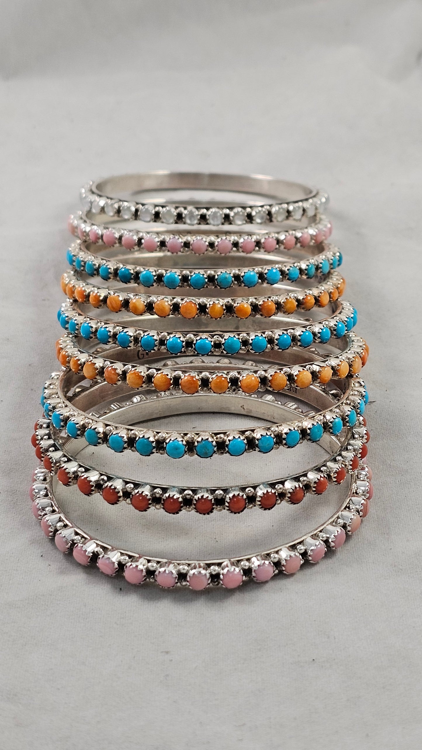 Snake eye bangle bracelets.